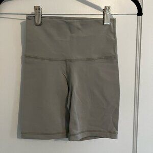 Aritzia TNA Action High Rise Bike Shorts - light sage green